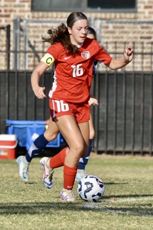 Olivia Leddy dribbling a soccer ball