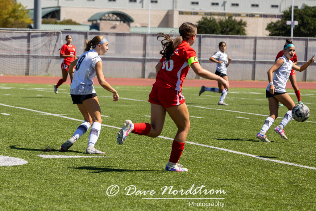 Olivia Leddy running while playing soccer