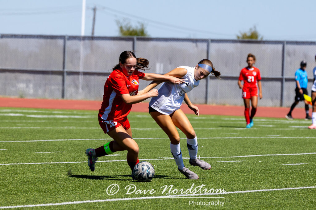 Olivia Leddy playing soccer against another team